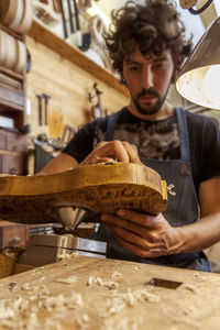 Craftsman violinmaker began working on a new violin in his workshop