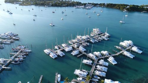 High angle view of sailboats moored at harbor