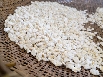 High angle view of white flowers in basket