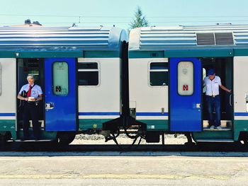 TRAIN ON RAILROAD STATION PLATFORM