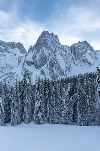 Scenic view of snow covered mountains against sky