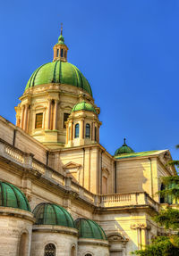 Low angle view of building against blue sky