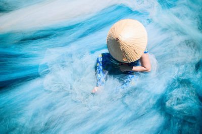 High angle view of woman in swimming pool