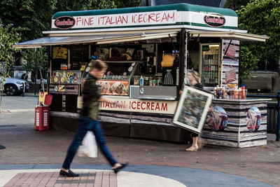 People walking on street in city