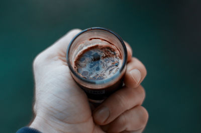 Cropped hand holding coffee