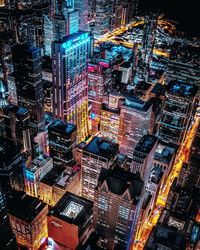 High angle view of illuminated buildings in city