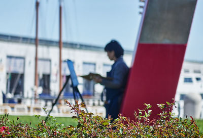 Side view of man against plants