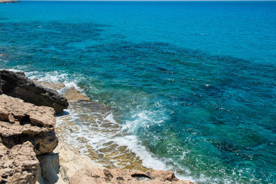 High angle view of sea against blue sky