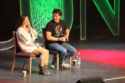 Full length of young couple sitting on chair