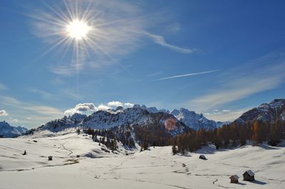 Scenic view of snowcapped mountains against sky