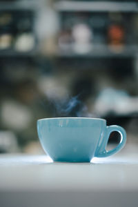 Close-up of coffee cup on table