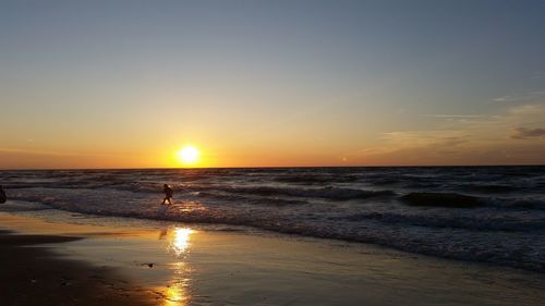 Scenic view of sea at sunset