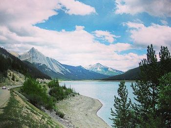 Scenic view of lake against cloudy sky