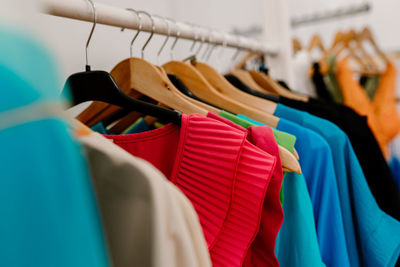 Close-up of clothes hanging in store