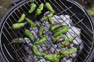 High angle view of pimentos on barbecue grill