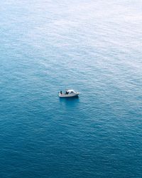 High angle view of boat sailing in the blue sea/ocean/lake