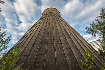 Low angle view of building against cloudy sky