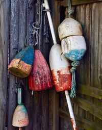 Close-up of clothes hanging on rope against wall