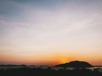 Scenic view of silhouette landscape against sky during sunset
