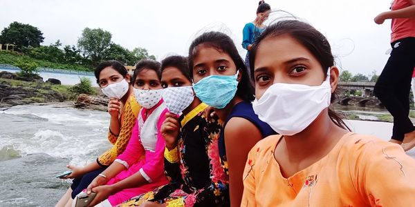Portrait of two people in water