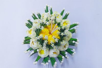 Close-up of flower bouquet against white background