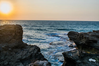 Scenic view of sea against sky during sunset