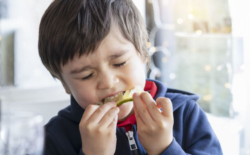 Close-up of boy eating food