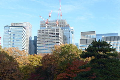 Low angle view of modern buildings against sky