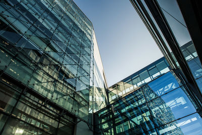 Low angle view of modern buildings against clear sky