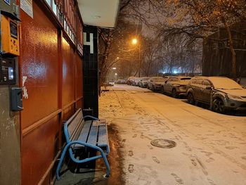 Car on street in city during winter at night