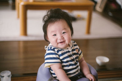 Portrait of cute baby girl at home