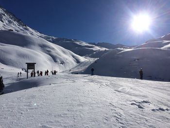 Scenic view of snow covered mountain against sky