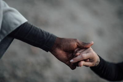 Close-up of man holding hands