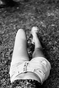 Low section of woman relaxing on land