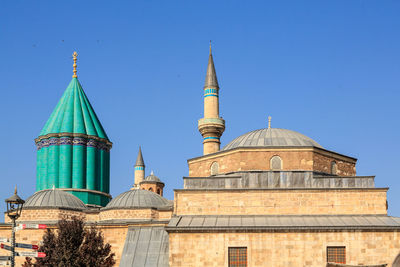 Low angle view of mosque against blue sky