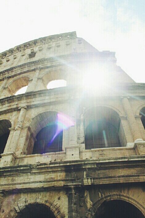 architecture, built structure, building exterior, low angle view, church, religion, sun, sunlight, sky, history, lens flare, sunbeam, building, place of worship, old, arch, spirituality, window, day