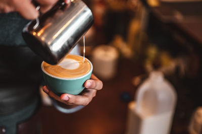 Close-up of coffee cup on table at cafe