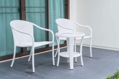 Empty chairs and tables on floor at home