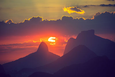 Silhouette mountain against sky during sunset