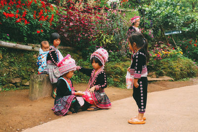 Full length of children on plant