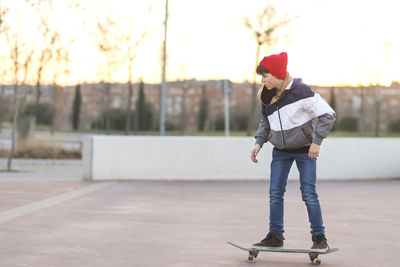 Boy skateboarding outdoors