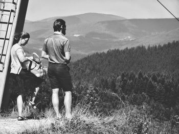 Full length of woman standing on grassy field
