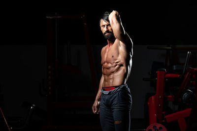 Young man exercising in gym