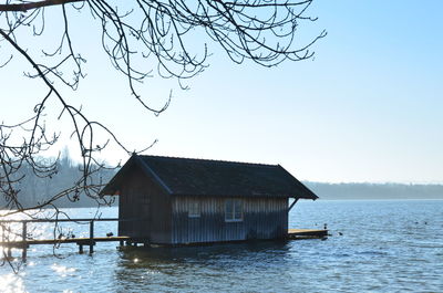 Scenic view of lake against clear sky during winter