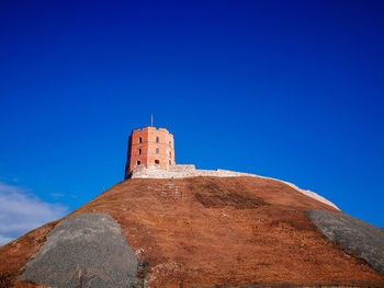 Low angle view of building against blue sky