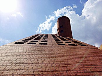 Low angle view of building against cloudy sky