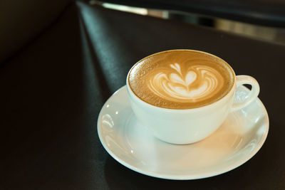 High angle view of cappuccino on table