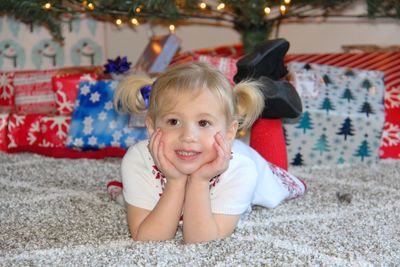 Girl lying down on carpet 