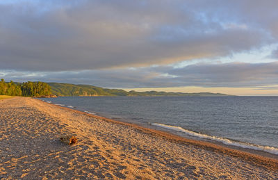 Evening shadows on a gravel beach on agawa bay in lake superior provincial park in ontario