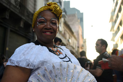 Portrait of smiling woman standing outdoors